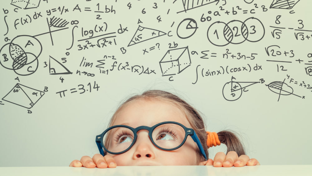 beautiful-cute-little-girl-with-math-formulas-and-problems