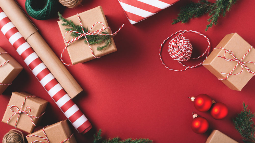 christmasbackgroundwithgiftsanddecorationsonred-preparationfor