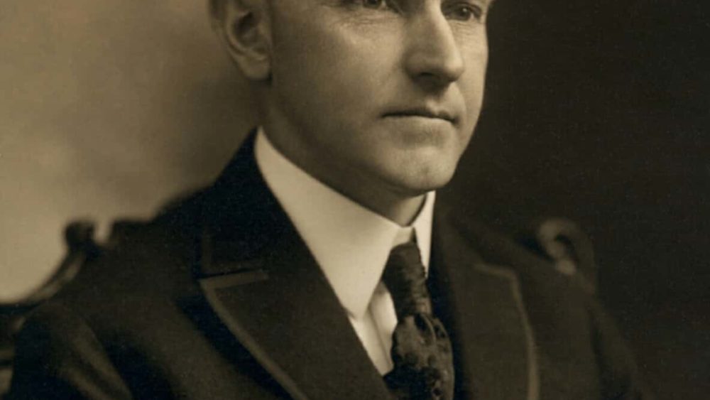 calvin_coolidge_bw_head_and_shoulders_photo_portrait_seated_1919