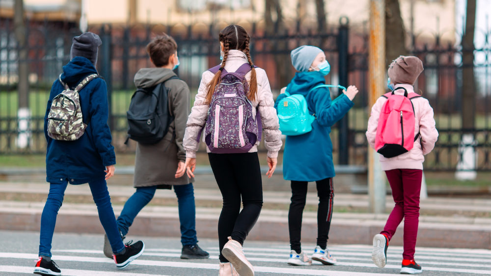 school-children-cross-the-road-in-medical-masks-children-go-to-school