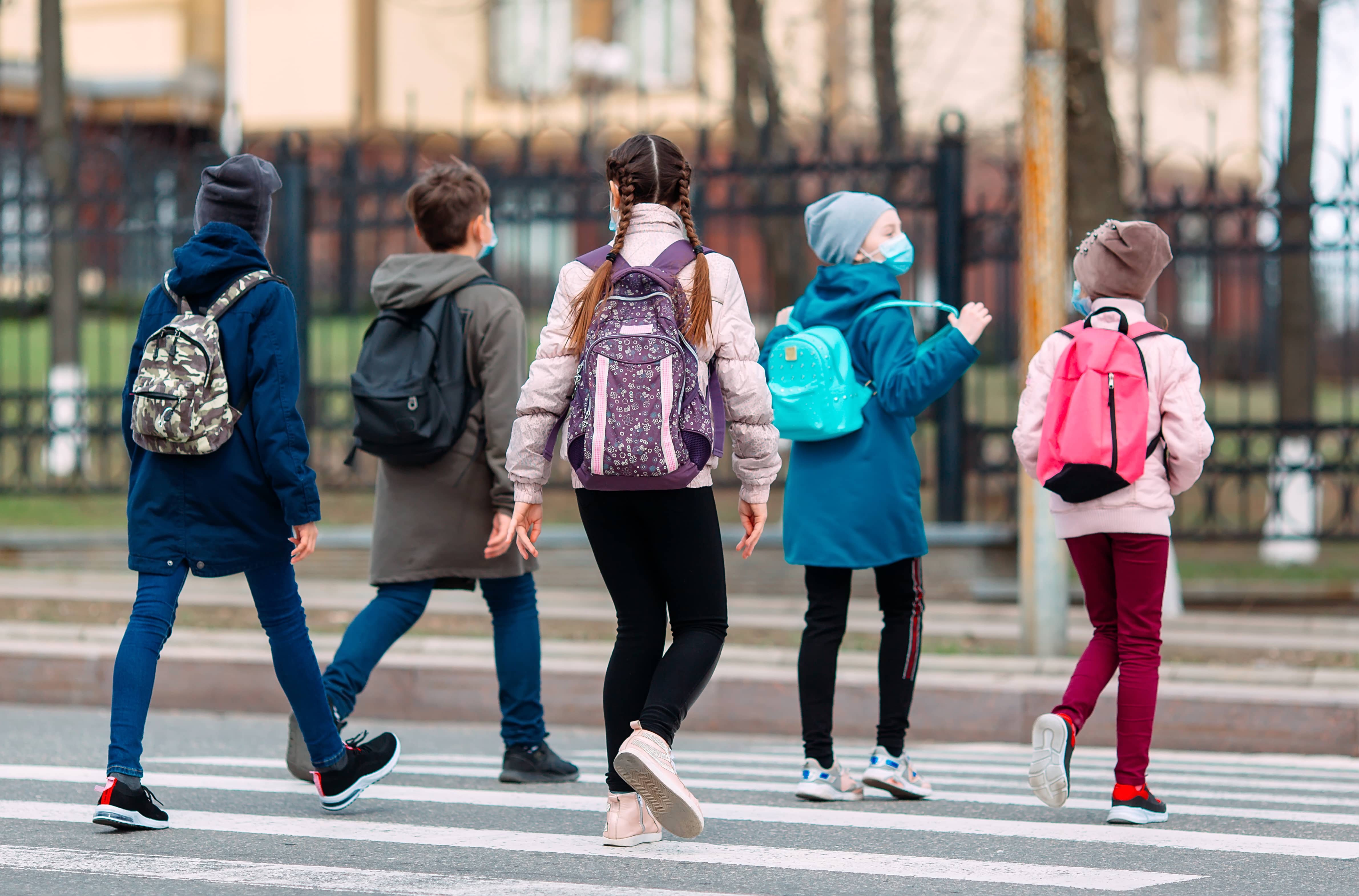 school-children-cross-the-road-in-medical-masks-children-go-to-school