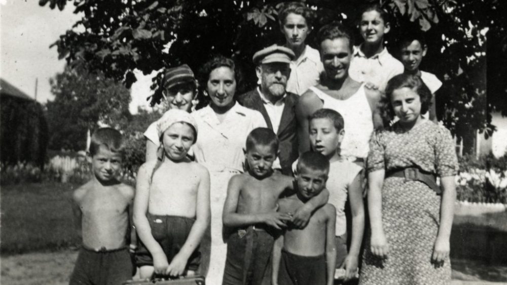Janusz Korczak poses with children and staff in his orphanage
