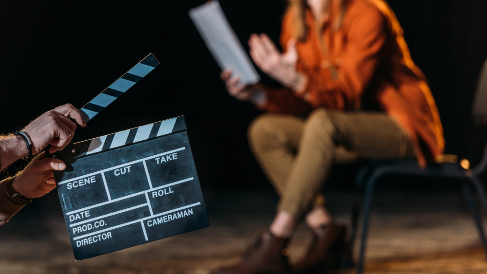 selectivefocusofactorwithclapboardinfront