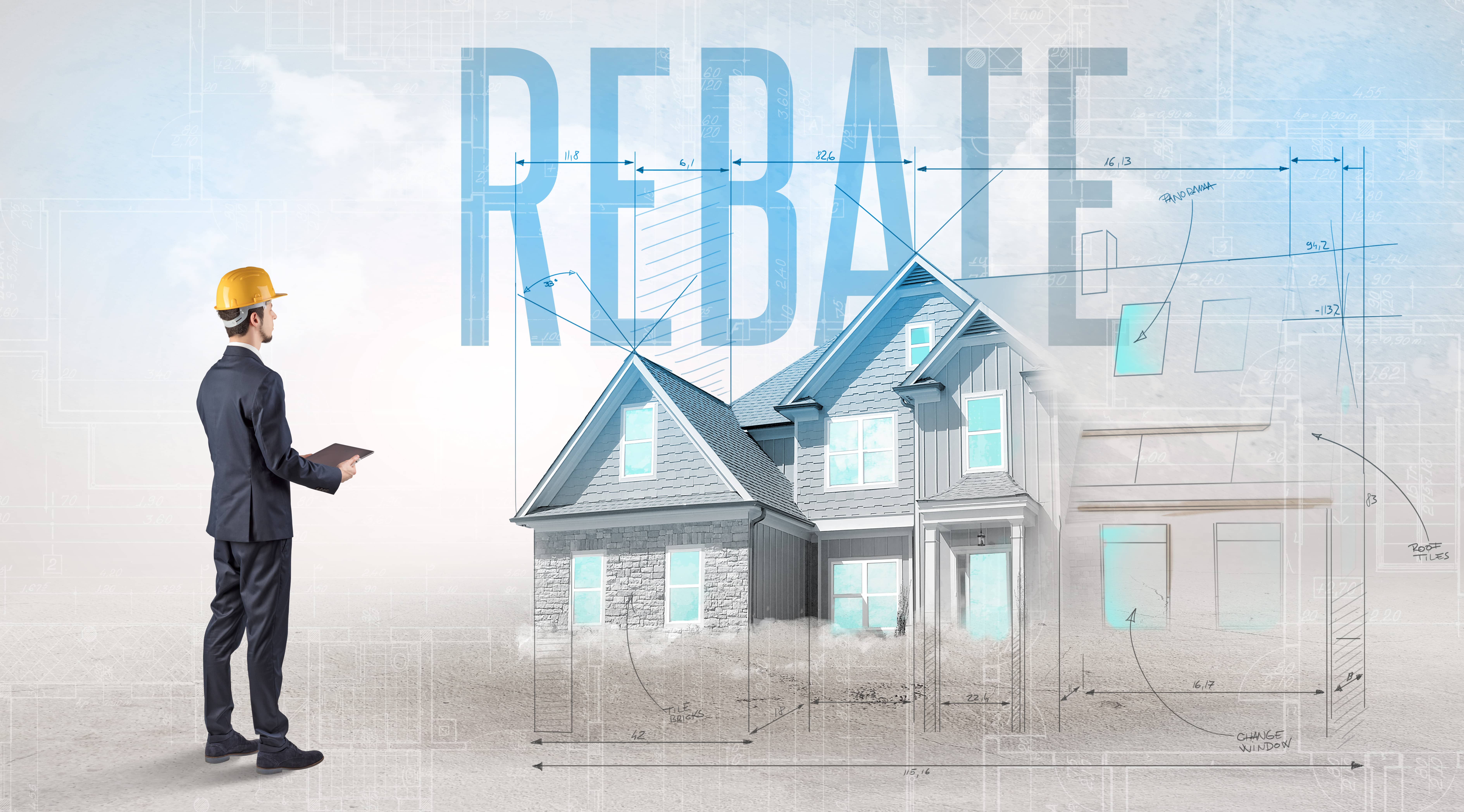 youngengineerholdingblueprintwithrebateinscriptionhouseplanningconcept