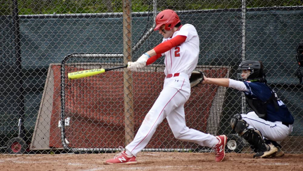 Greenwich High School senior Christian Mingione swings for the fences during a recent game at the GHS bsaeball field. Against Newtown, he finished 2-for-3 with one run scored.