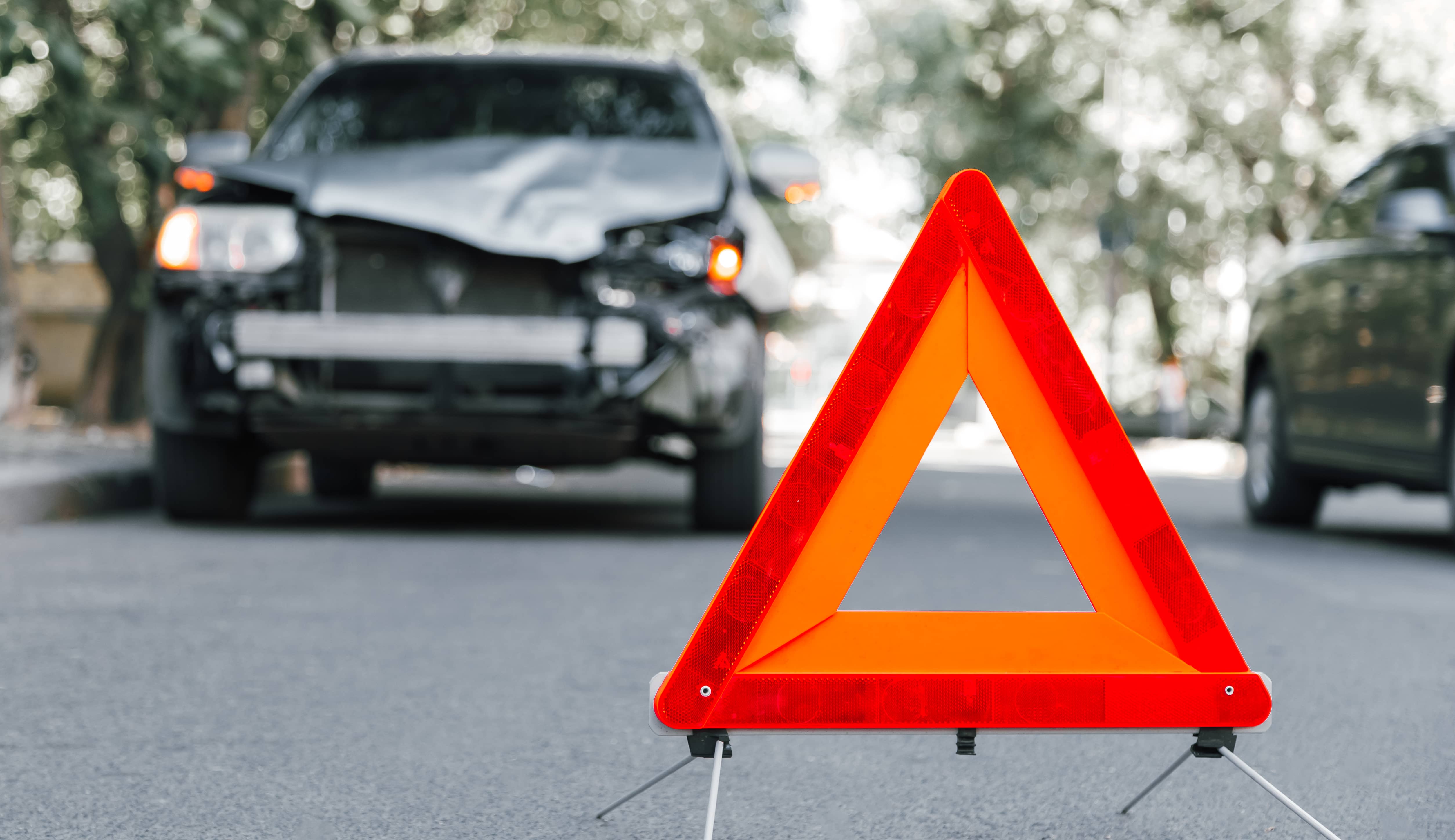 redemergencystoptrianglesignonroadincaraccident