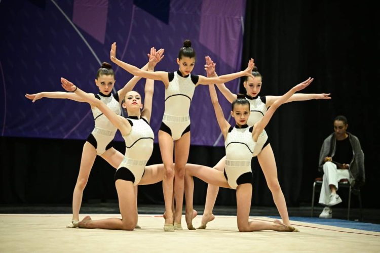 Split leap with clubs  Rhythmic gymnastics, Rhythmic gymnastics clubs,  Gymnastics