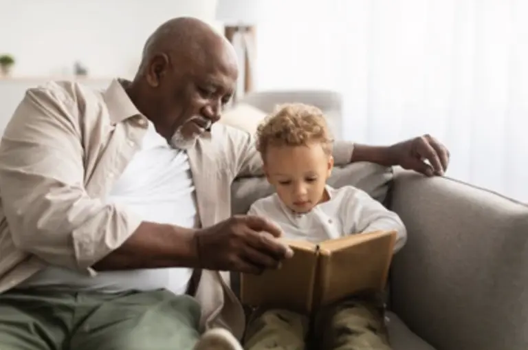 grandfather-reading-a-book-to-his-grandchild