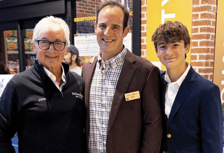 John Sr, John Jr., his son John, a student at Fordham Prep who was bagging groceries at the opening.