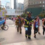 Tunnel to Towers Run: Participants cross an intersection during the Tunnel to Towers 5K Run and Walk, Sunday, Sept. 29, 2019, in New York's Lower Manhattan. The race retraces the footsteps of Stephen Siller, a firefighter who was killed on 9/11 after running in full gear through the Battery Tunnel to ground zero. (AP Photo/Julie Walker)