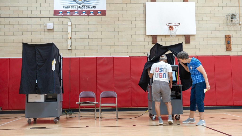 A man enters the voting booth for the primary election at Roy W. Brown Middle School in Bergenfield, NJ on Tuesday June 4, 2024.