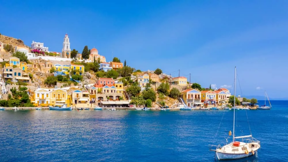 Colored houses village in Symi island^ Dodecanese islands^ Greece.