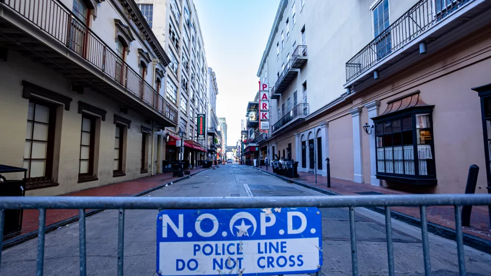 A New Orleans Police Department barricade blocks a side street leading into the mass casualty area for law enforcement to investigate the scene.