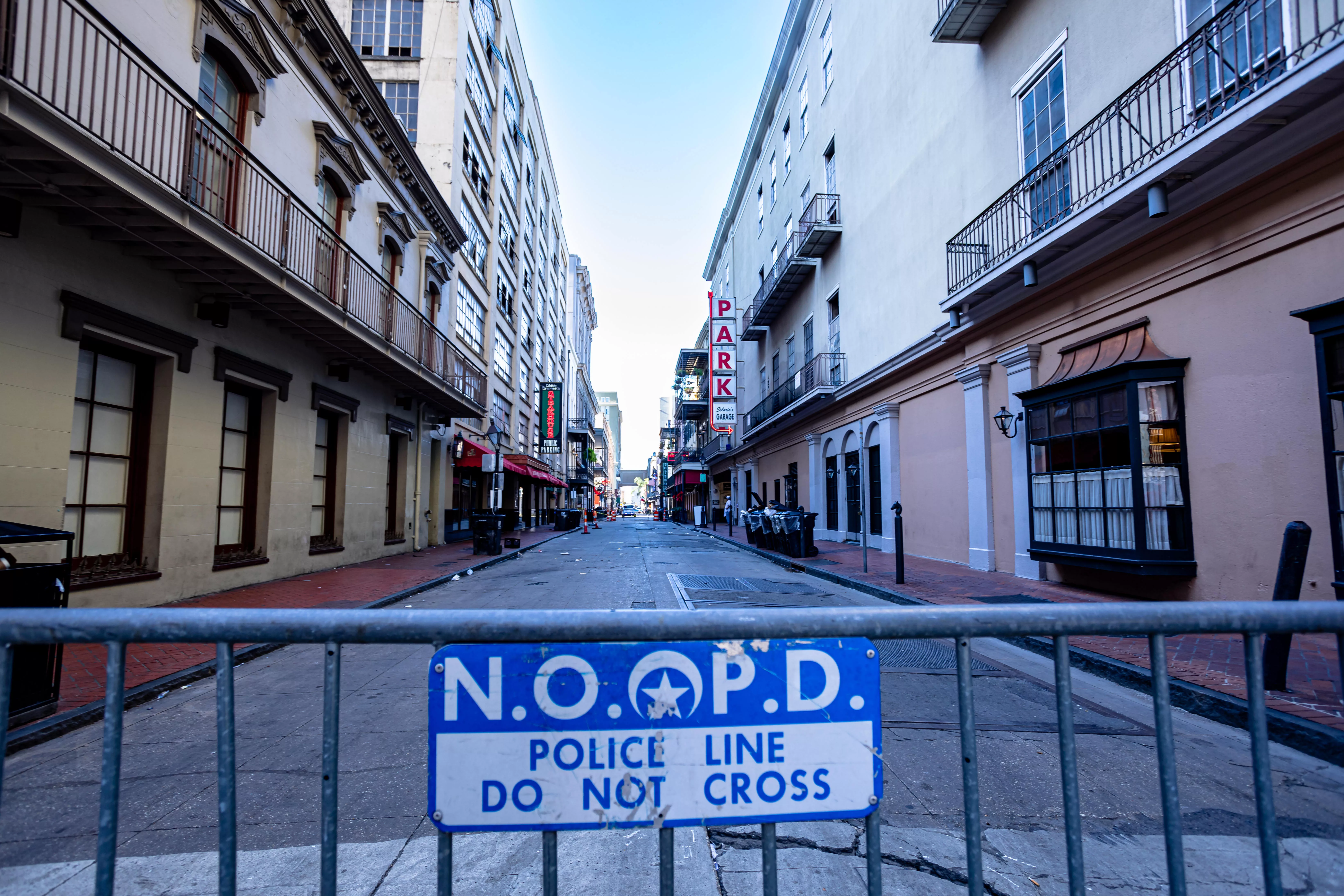 A New Orleans Police Department barricade blocks a side street leading into the mass casualty area for law enforcement to investigate the scene.