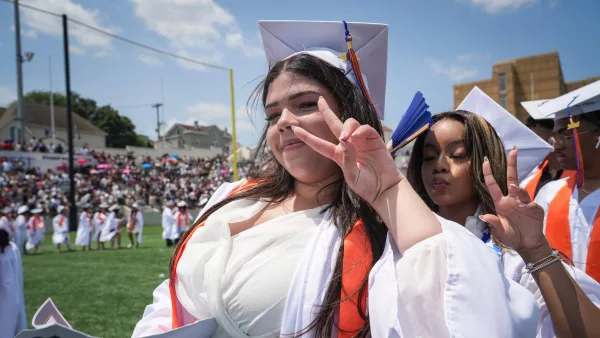 Who holds an outdoor graduation when it’s 98 degrees?