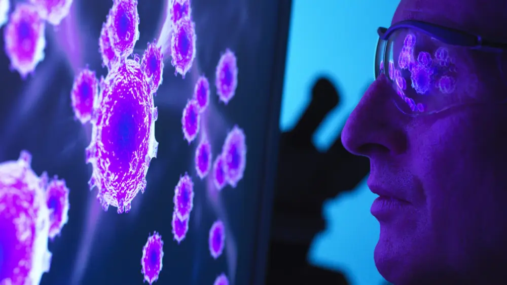 scientist-viewing-a-image-of-virus-using-a-electron-microscope-in-the-laboratory