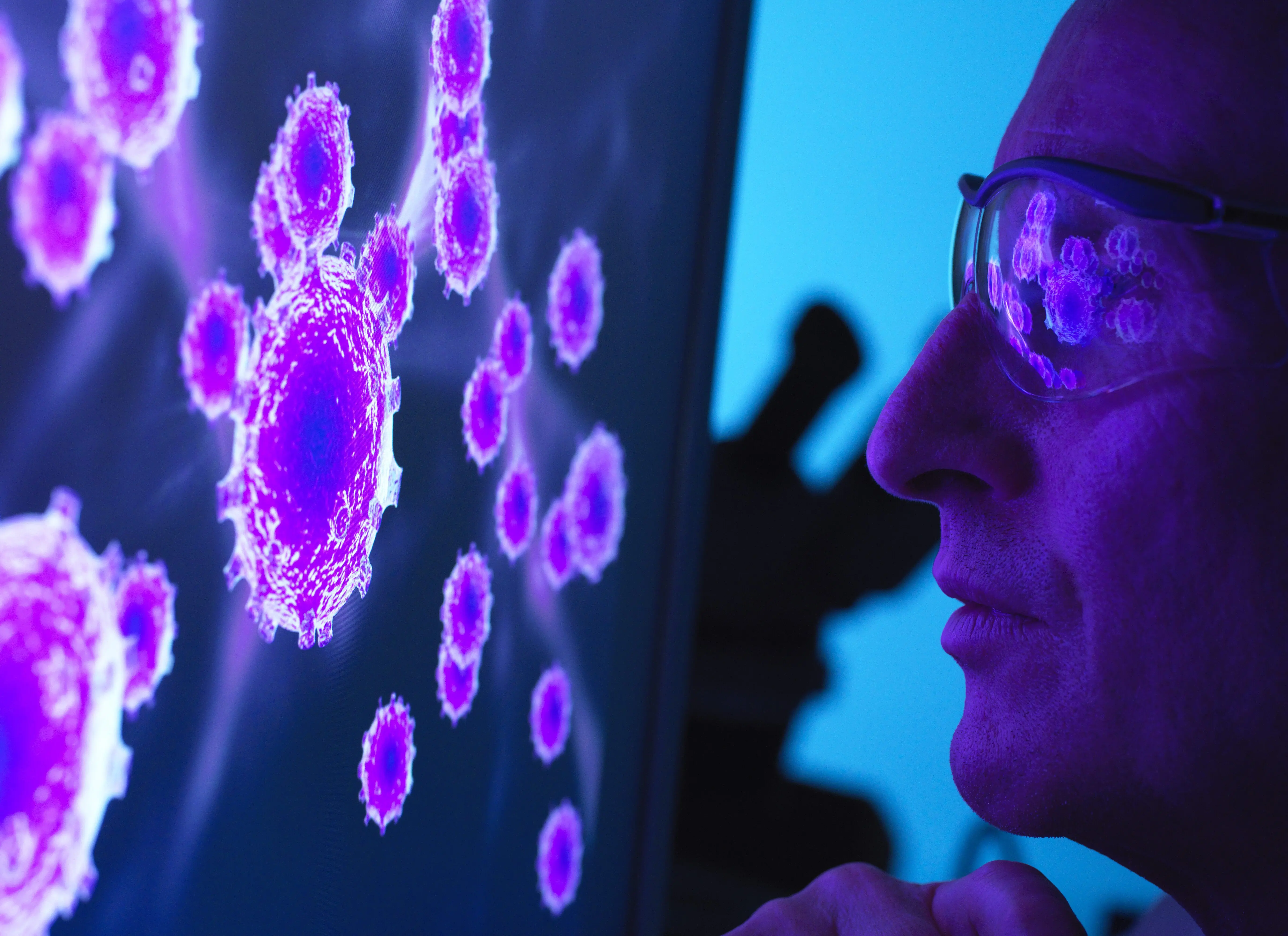 scientist-viewing-a-image-of-virus-using-a-electron-microscope-in-the-laboratory