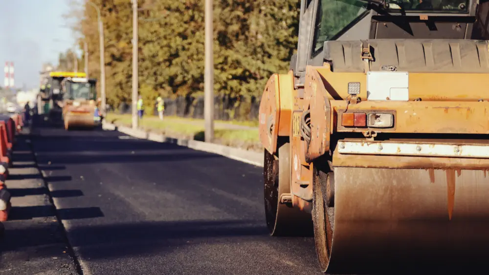 road-construction-crew-working-on-asphalt-paving-in-a-vibrant-outdoor-setting