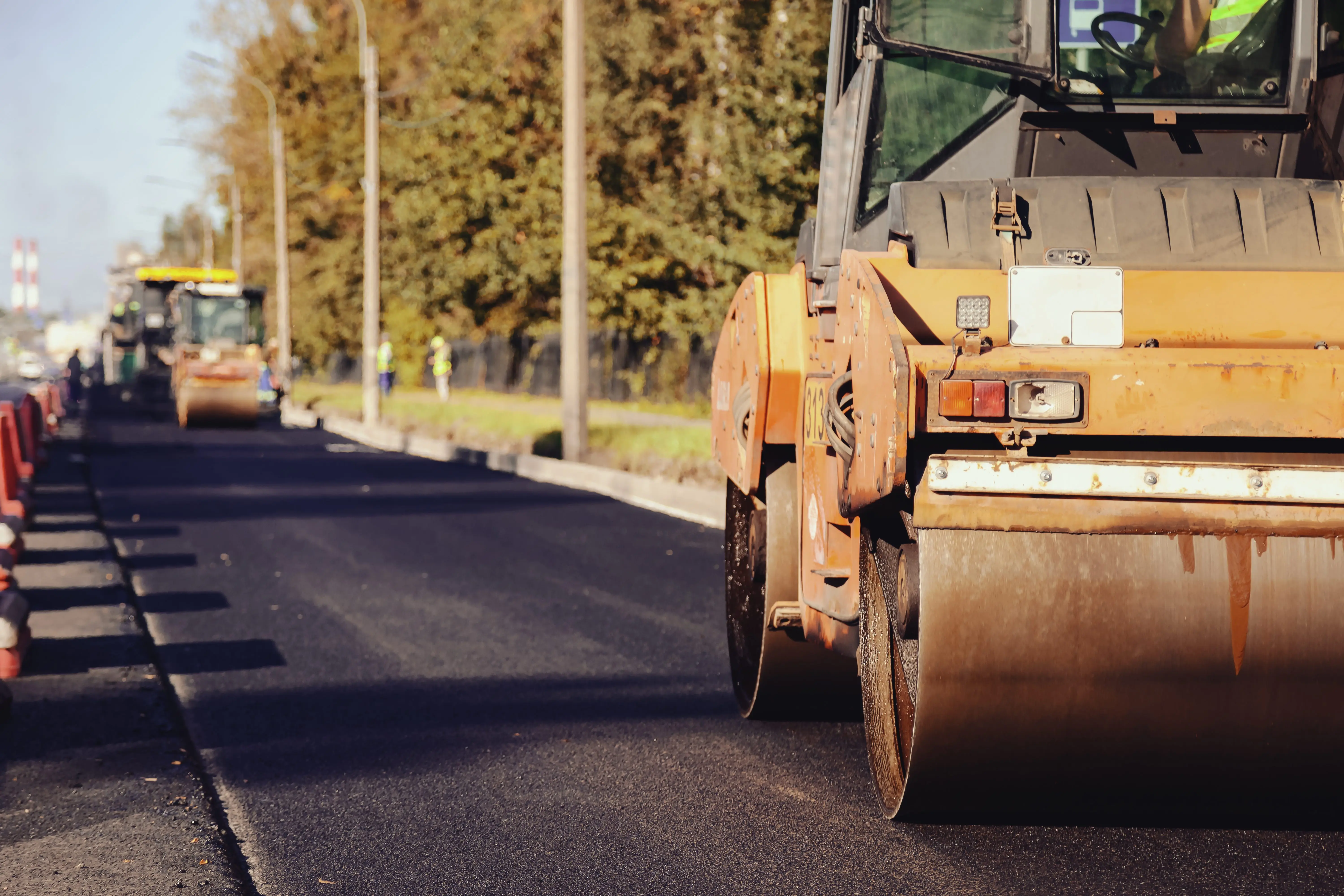 road-construction-crew-working-on-asphalt-paving-in-a-vibrant-outdoor-setting