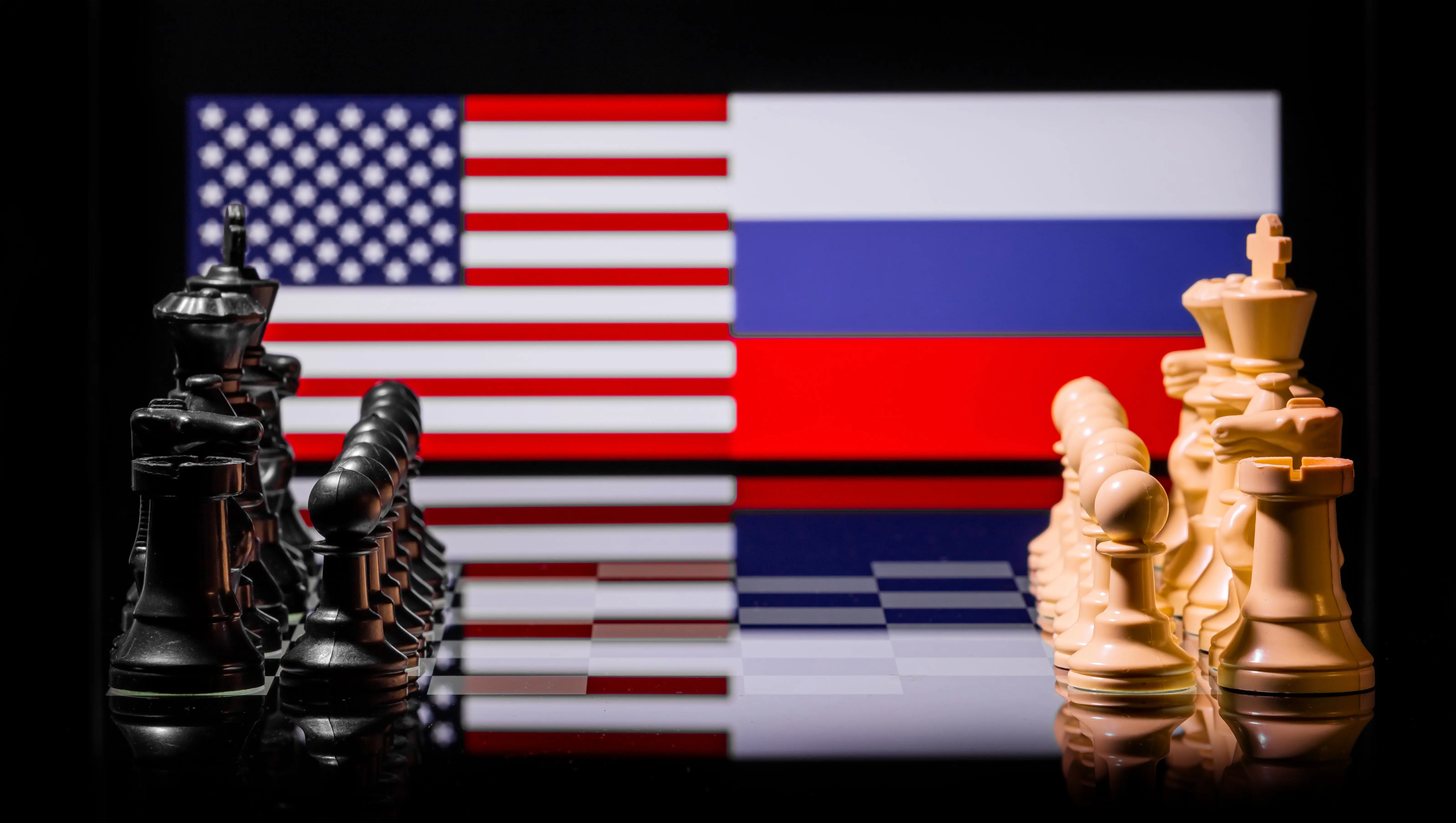 war-between-the-united-states-and-russia-using-chess-pieces-and-flags-on-a-reflective-background