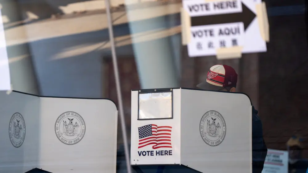 voters-cast-their-ballot-at-a-polling-station-during-early-voting-in-new-york-city-2