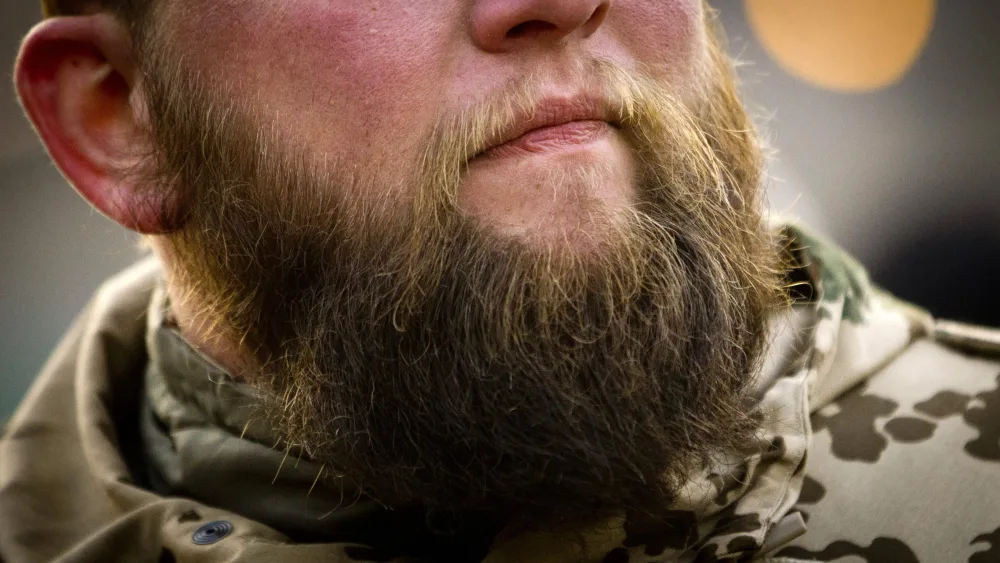 bearded-german-isaf-soldier-listens-to-speech-by-german-defence-minister-thomas-de-maiziere-at-camp-marmal-outside-mazar-e-sharif