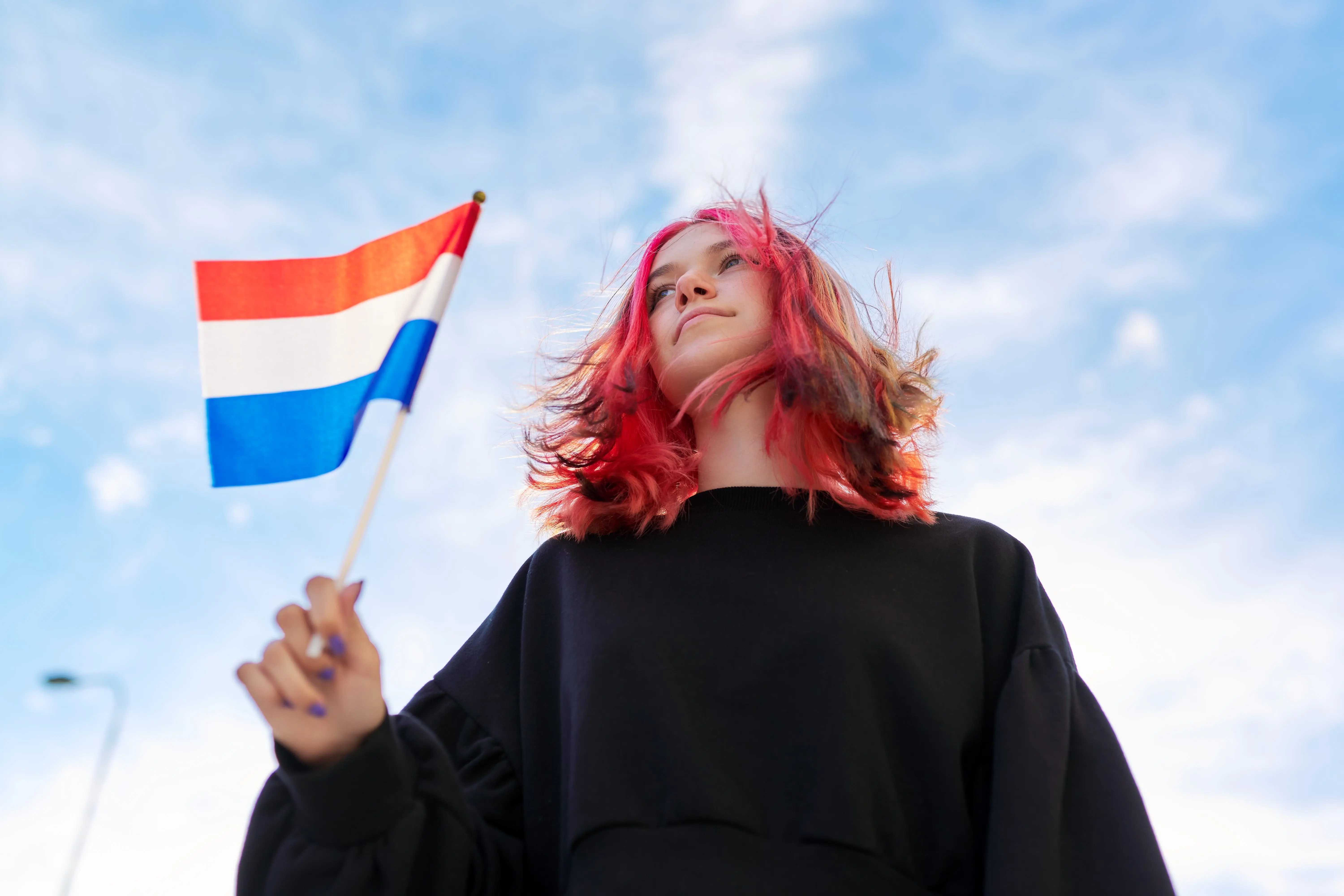 student-girl-teenager-with-the-flag-of-the-netherlands-in-hand