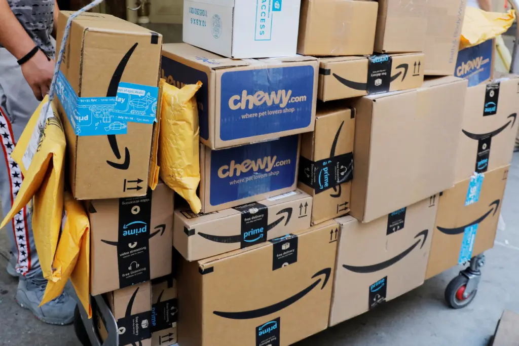 a-delivery-cart-loaded-with-a-number-of-packages-from-amazon-stands-on-a-sidewalk-in-new-york-city