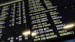baseball-betting-odds-are-displayed-at-monmouth-park-sports-book-by-william-hill-on-the-opening-of-the-first-day-of-legal-betting-on-sports-in-oceanport