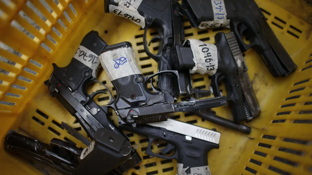 destroyed-pistols-are-pictured-during-an-exercise-to-disable-seized-weapons-in-caracas
