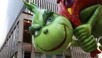 a-grinch-float-hovers-above-the-crowd-during-the-macys-thanksgiving-day-parade-in-manhattan