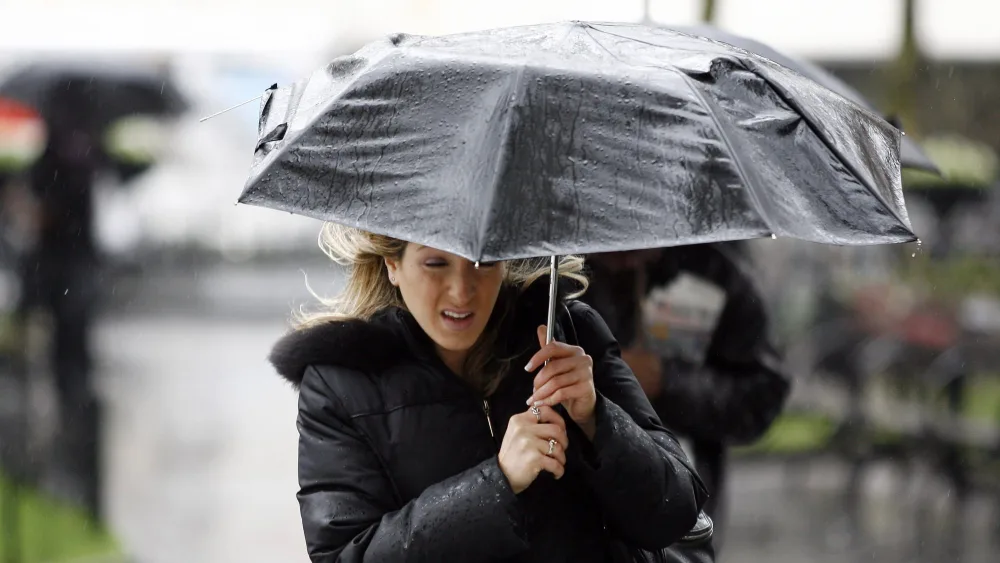 a-woman-makes-her-way-through-rainfall-in-new-york