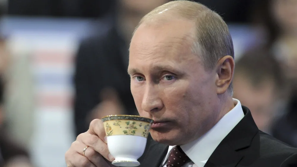 russian-pm-putin-drinks-during-a-televised-questions-and-answers-session-in-moscow
