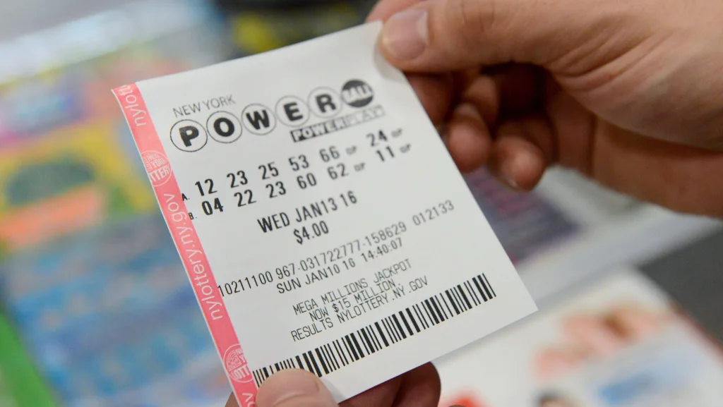 a-person-holds-a-powerball-ticket-in-new-york