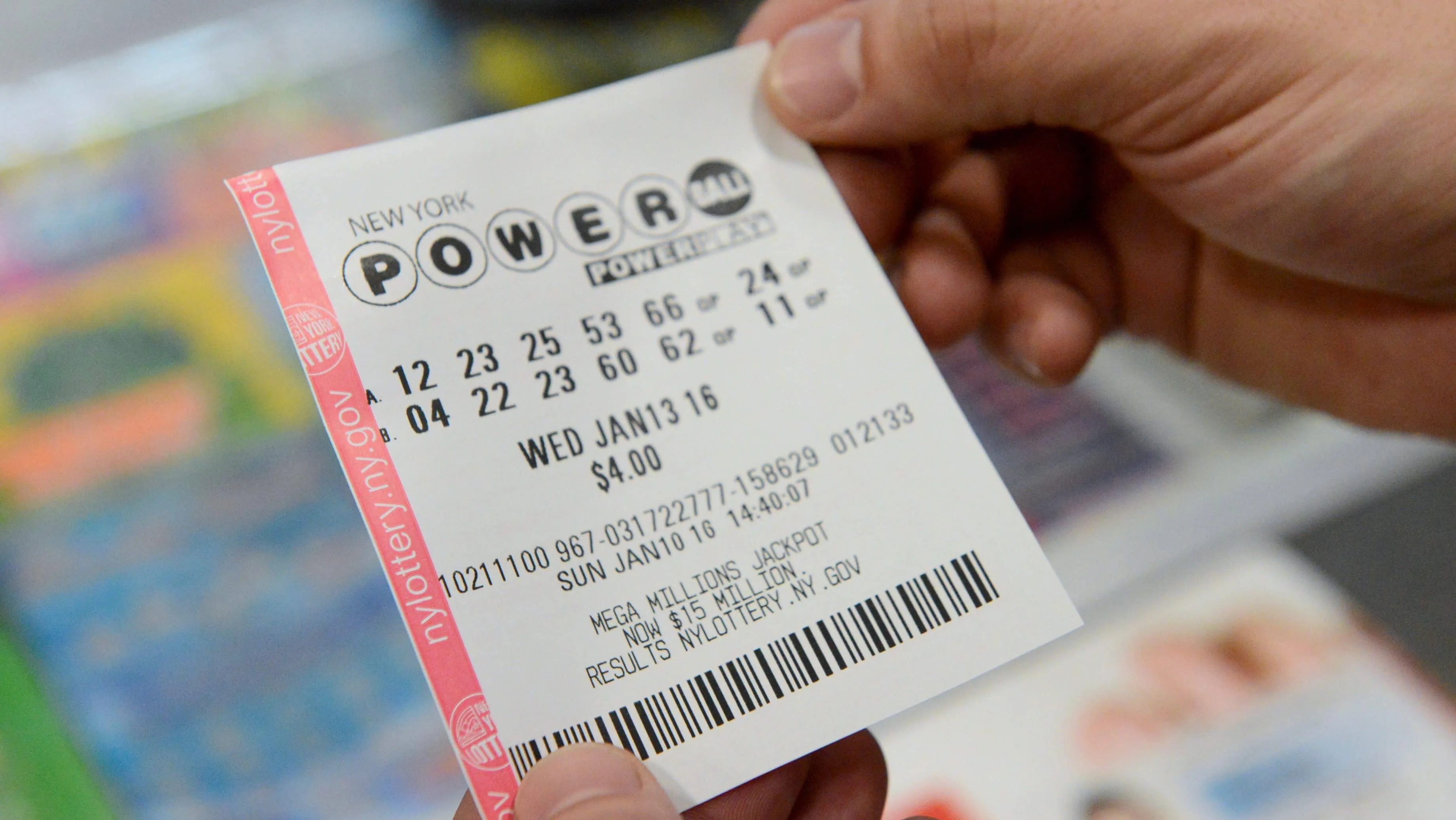 a-person-holds-a-powerball-ticket-in-new-york