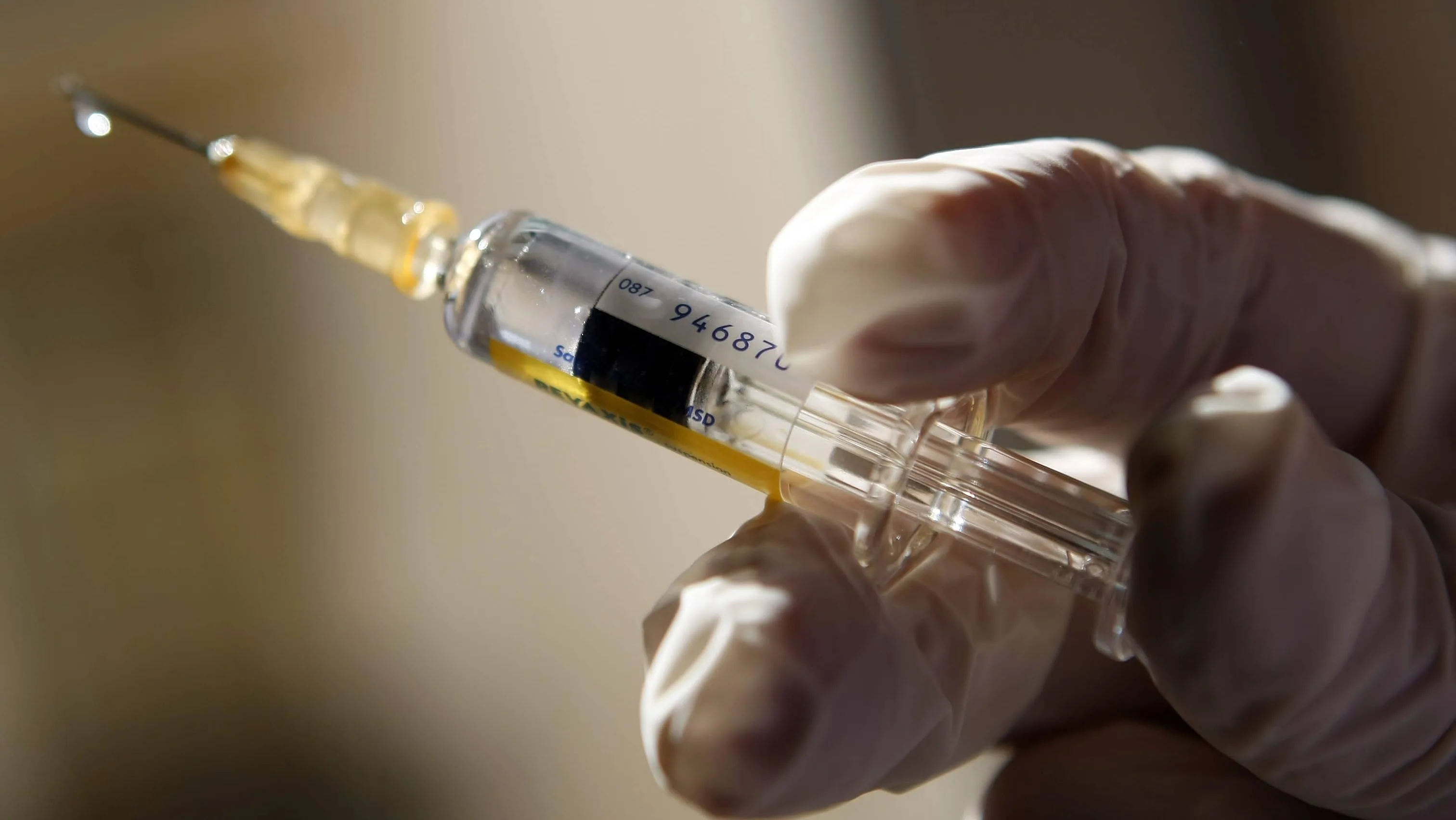 a-doctor-prepares-a-syringe-in-a-municipal-vaccination-centre-in-nice