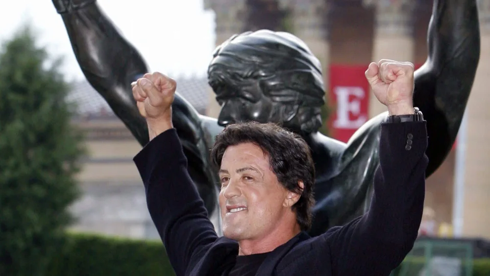 sylvester-stallone-poses-like-rocky-after-unveiling-the-rocky-statue-at-the-philadelphia-museum-of-art-in-philadelphia