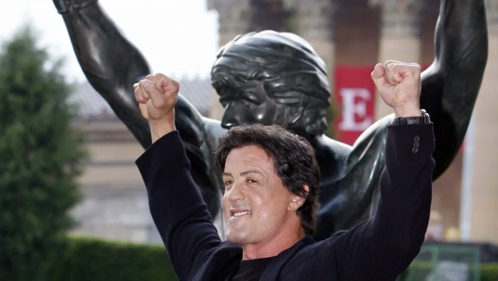 sylvester-stallone-poses-like-rocky-after-unveiling-the-rocky-statue-at-the-philadelphia-museum-of-art-in-philadelphia