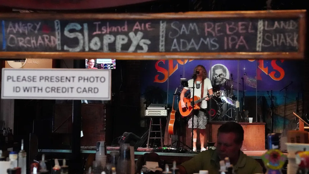 a-musician-performs-in-the-mostly-empty-sloppy-joes-bar-following-hurricane-irma-in-key-west-florida