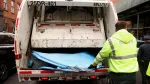 department-of-sanitation-worker-puts-a-tent-into-a-garbage-truck-in-new-york-city
