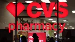 people-walk-by-a-cvs-pharmacy-store-in-manhattan-new-york-city