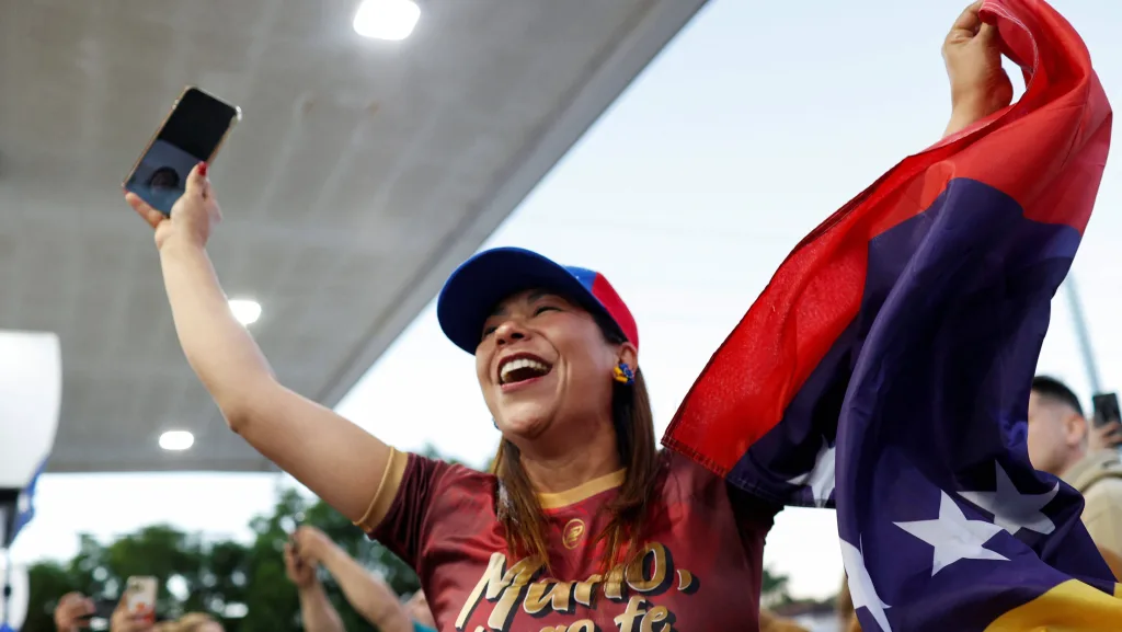 people-wave-venezuelan-flags-and-react-to-the-news-of-u-s-strikes-on-venezuela-and-capture-of-president-maduro-in-miami