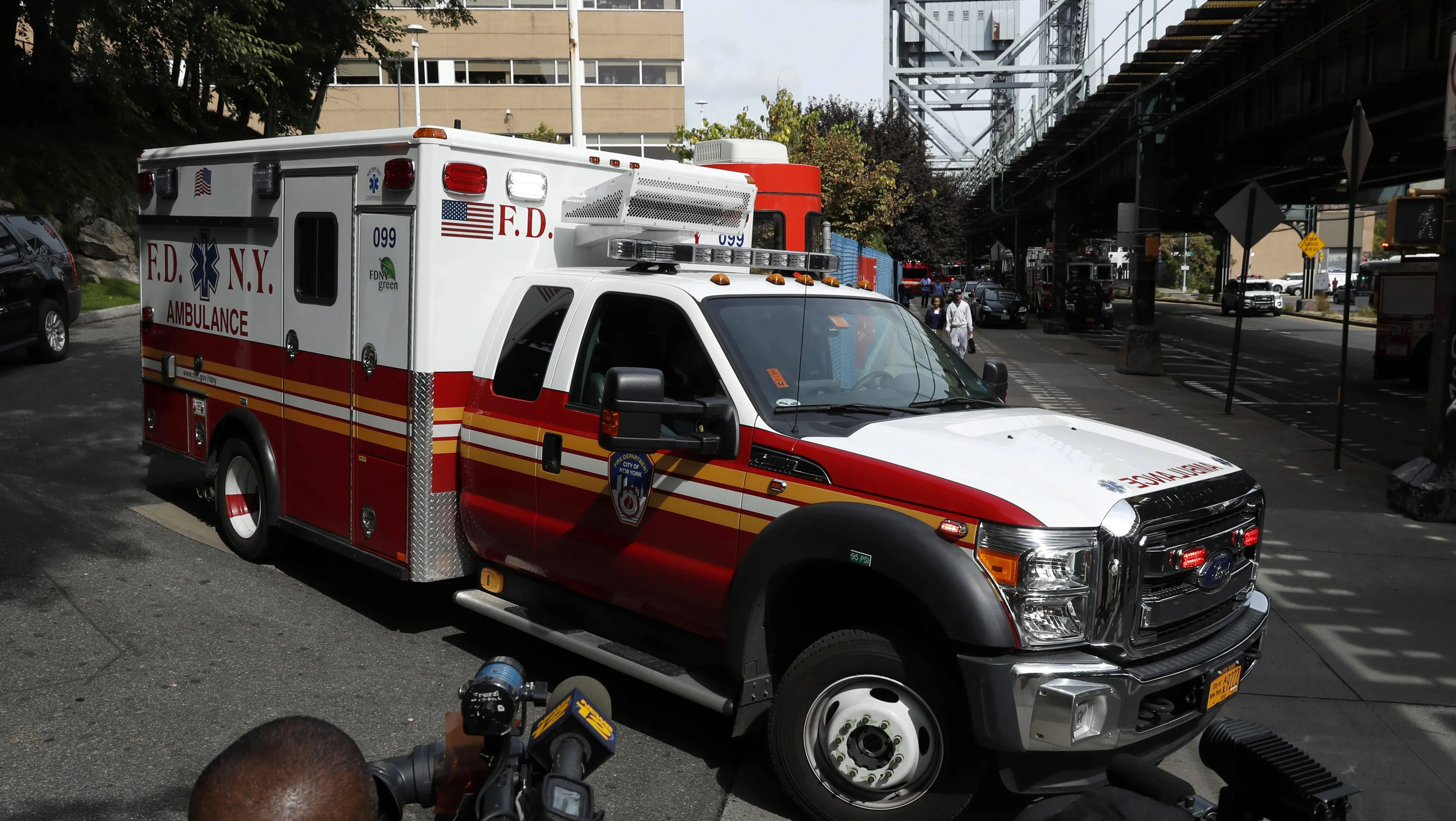 an-ambulance-carrying-the-body-of-fahy-drives-away-from-the-newyork-presbyterian-allen-hospital-past-members-of-the-media-in-new-york