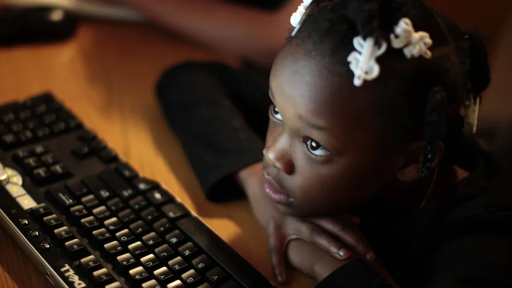 jayla-studies-on-a-computer-at-the-shelter-where-she-lives-in-los-angeles