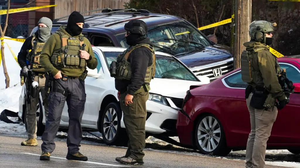 members-of-u-s-immigration-and-customs-enforcement-ice-stand-guard-after-a-driver-of-a-vehicle-was-shot-in-minneapolis