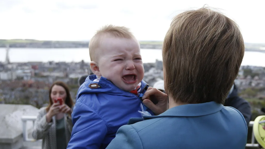 nicola-sturgeon-the-leader-of-the-scottish-national-party-holds-a-crying-baby-during-a-campaign-stop-in-dundee-scotland
