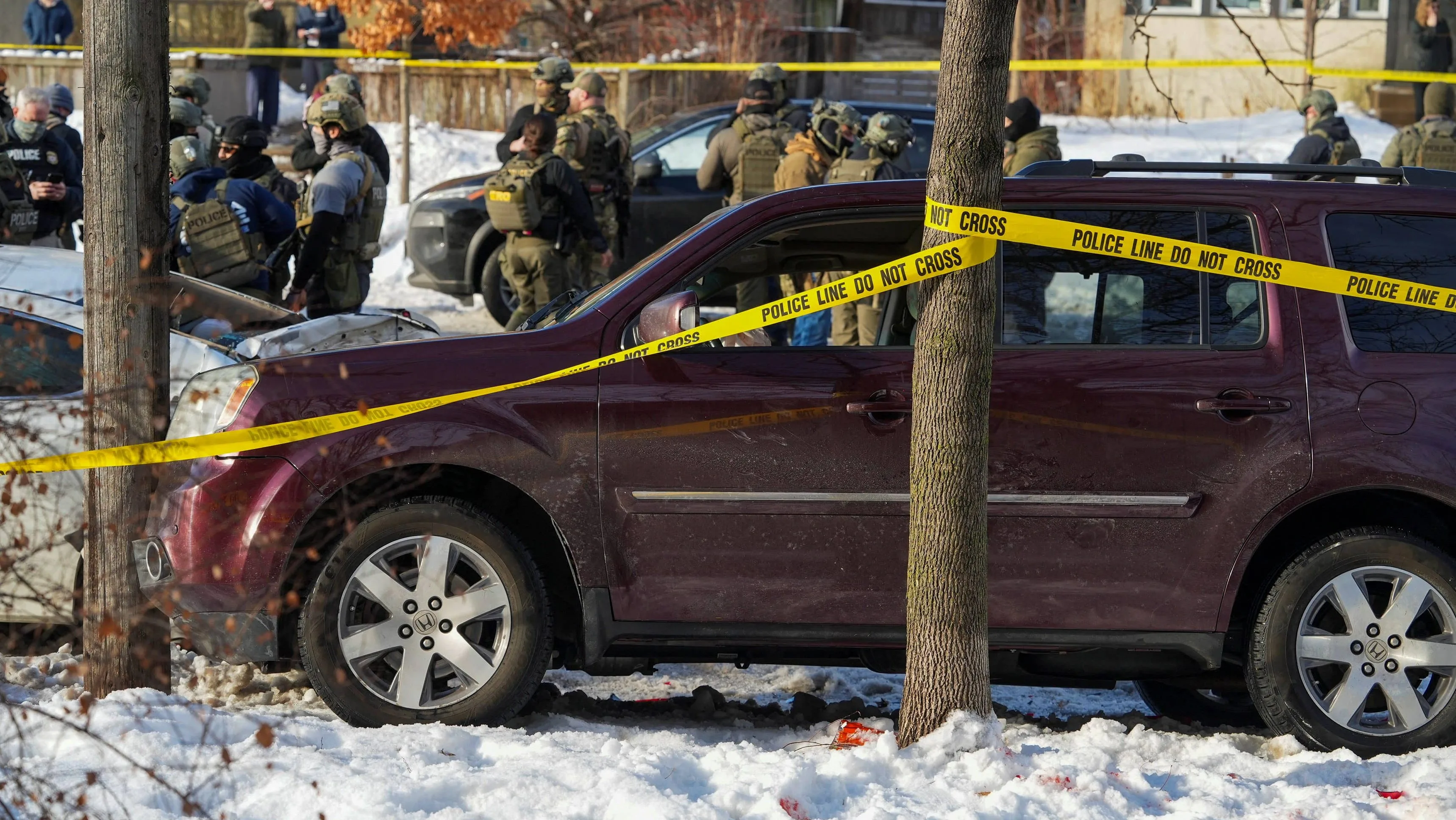 police-tape-surrounds-a-vehicle-after-its-driver-was-shot-by-a-u-s-immigration-agent-according-to-local-and-federal-officials-in-minneapolis