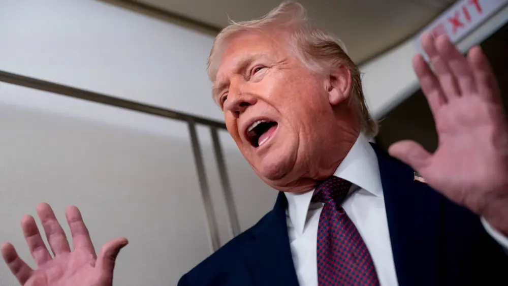 u-s-president-donald-trump-speaks-with-members-of-the-media-aboard-air-force-one-en-route-to-joint-base-andrews