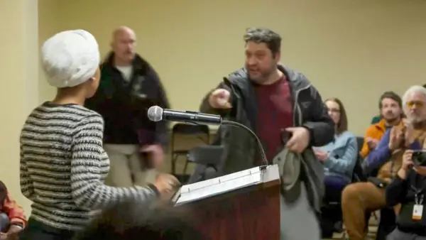 a-man-shouts-at-u-s-rep-ilhan-omar-after-spraying-her-during-a-town-hall-meeting-in-minneapolis