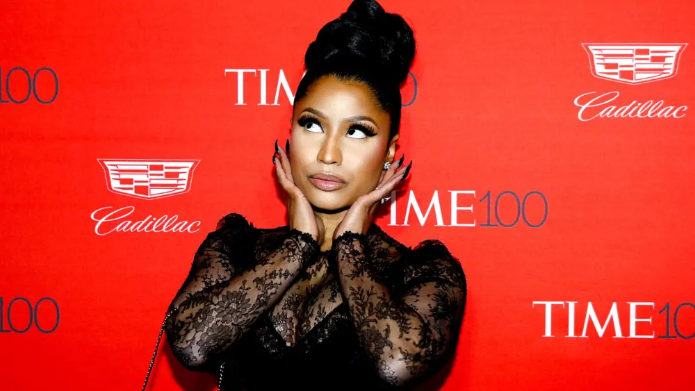 recording-artist-nicki-minaj-poses-for-photographers-on-the-red-carpet-as-she-arrives-for-the-time-100-gala-in-manhattan